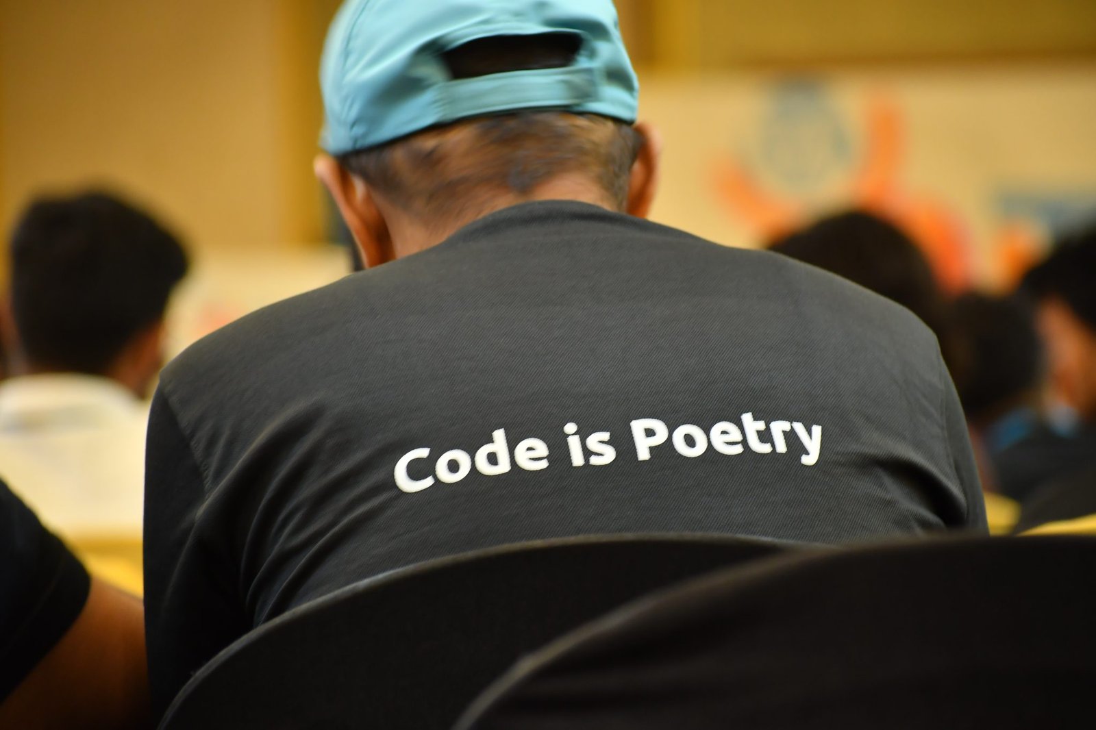 Photo taken from WordPress Youth camp – Wearing T-shirt with WordPress tagline “Code is Poetry”