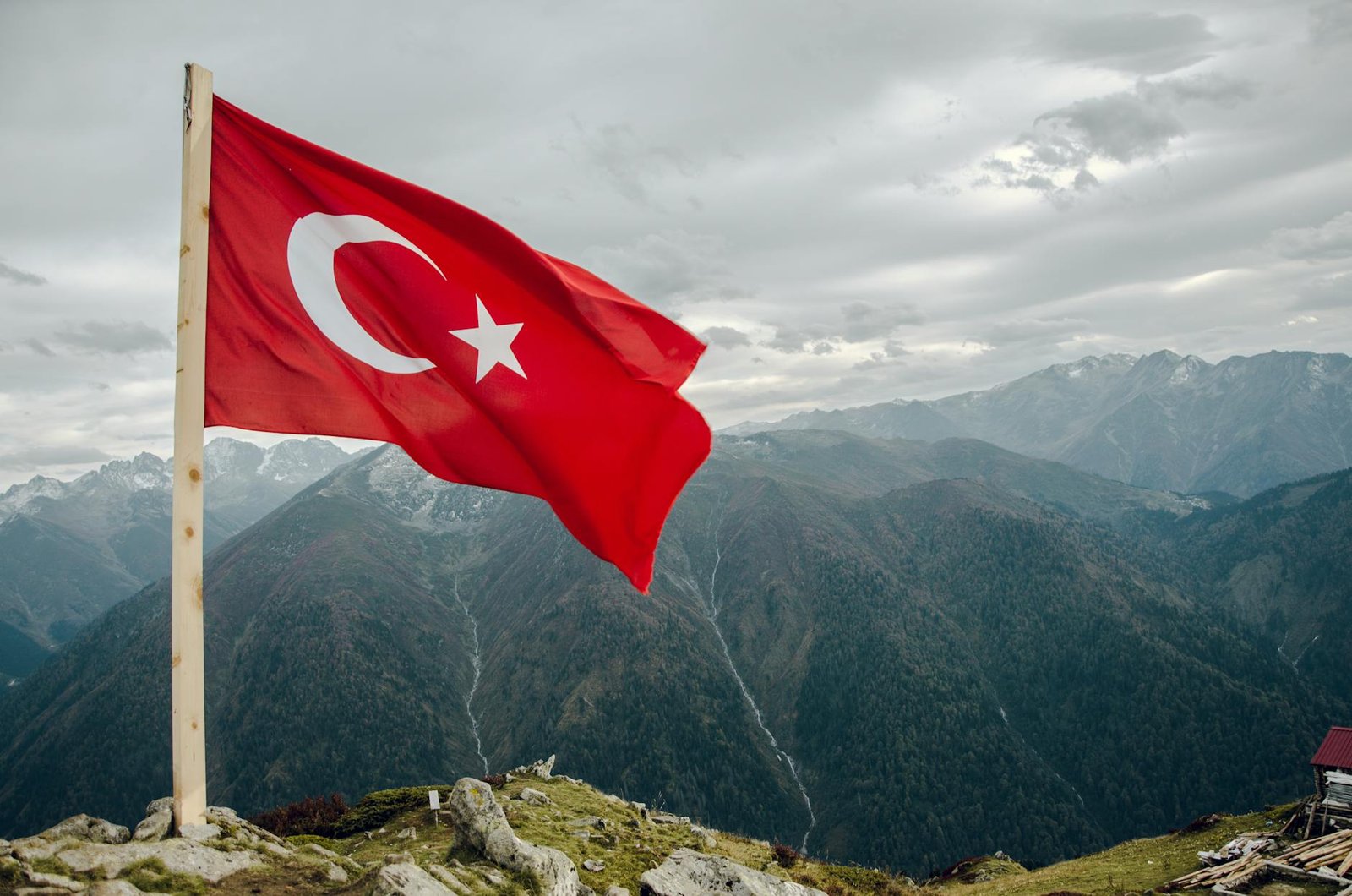 flag of turkey across mountain